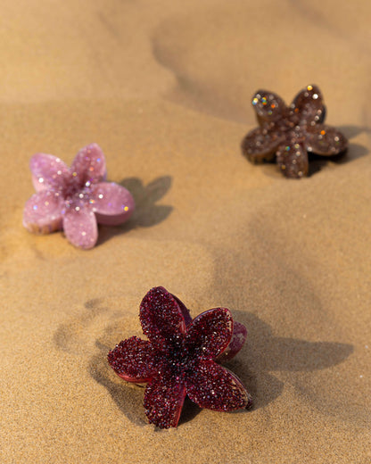 Brown, pink and burgundy diamante floral clips in sand